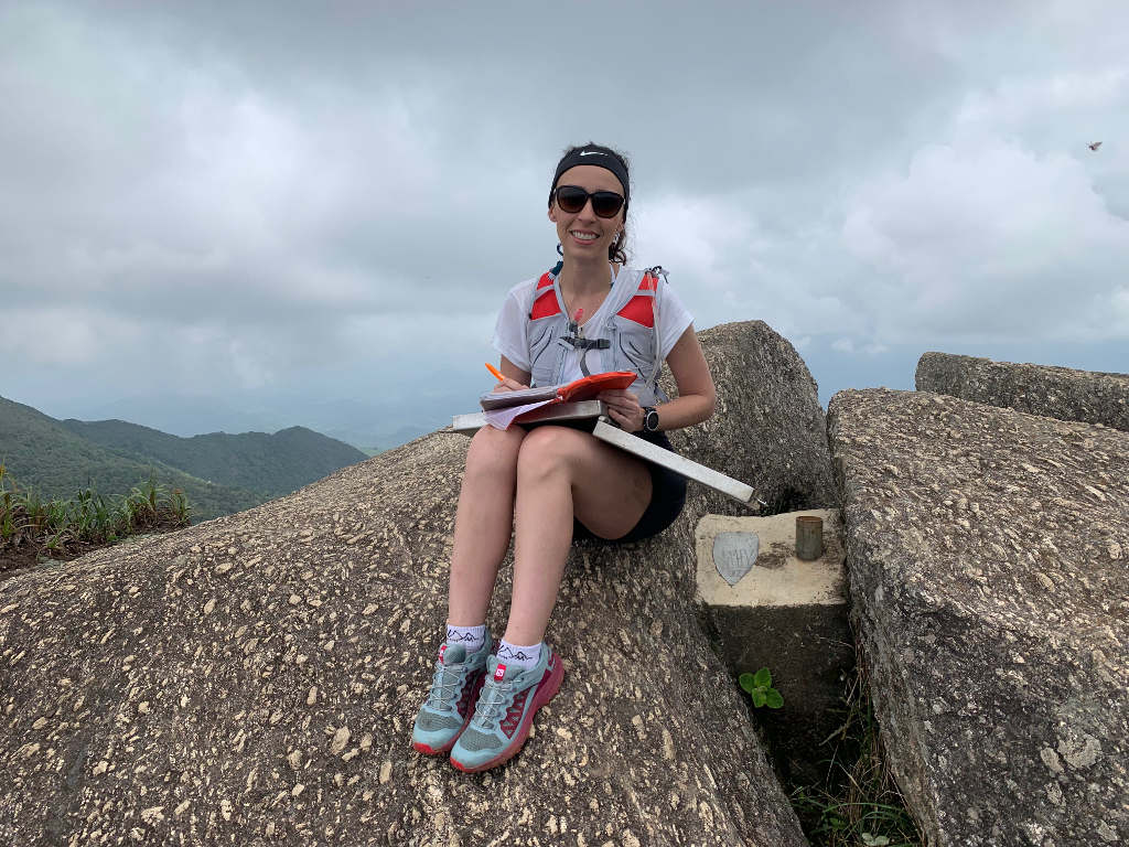Signing the summit logbook at Pedra Selada