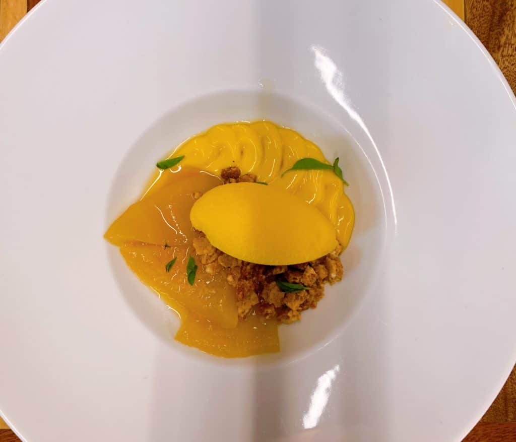 Yellow fruit dessert with a strong pequi flavor