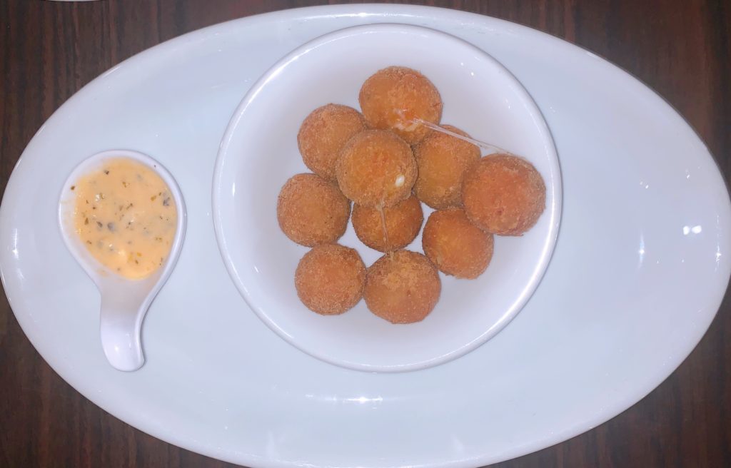 Bolinho de pirarucu with spicy sauce, Palmas, Tocantins, Brazil