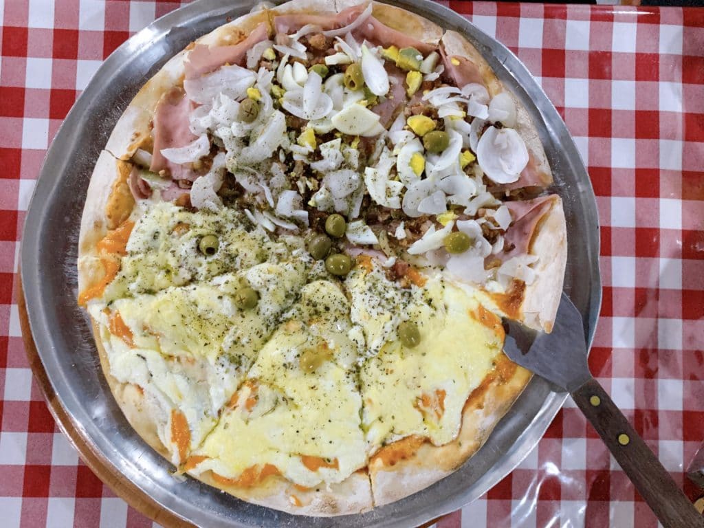 Six-cheese and Portuguese pizza