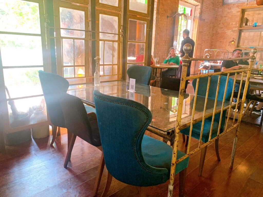 Old bed repurposed as a table at Restaurante Armazém Mazlawik