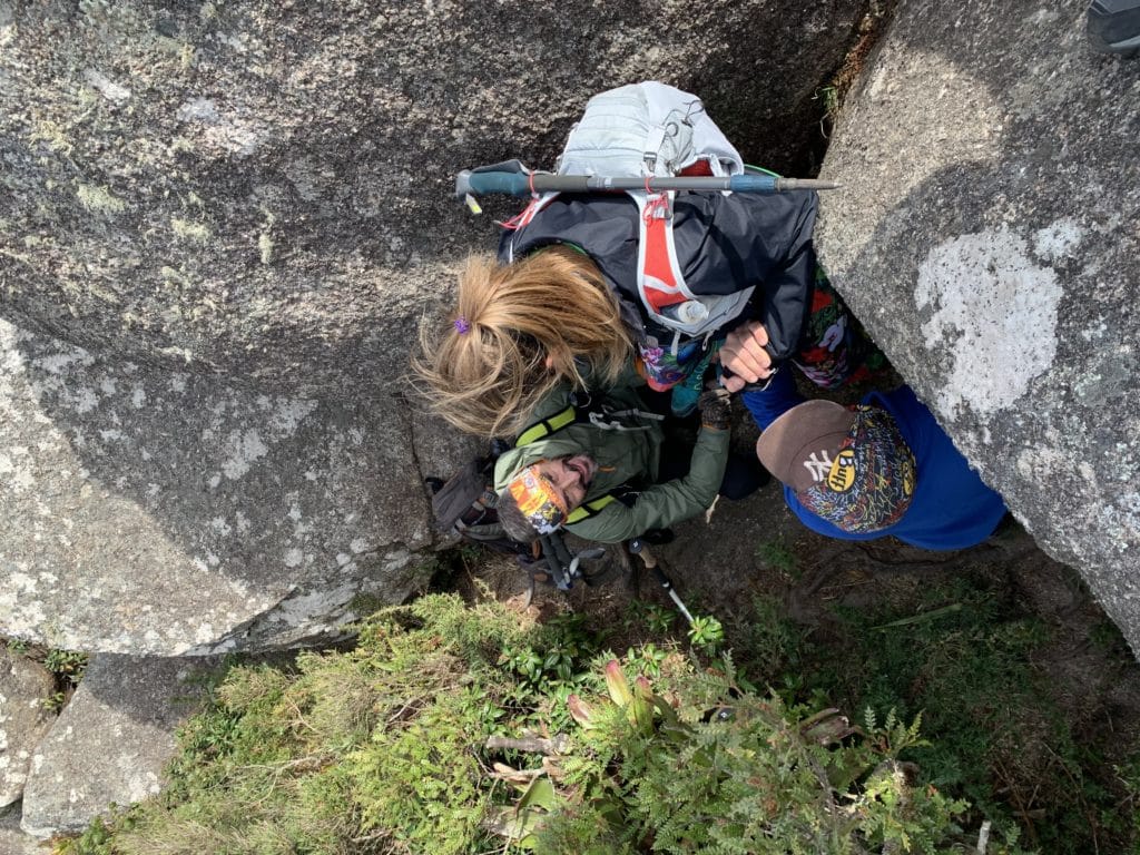 Getting help down the steep rock sections