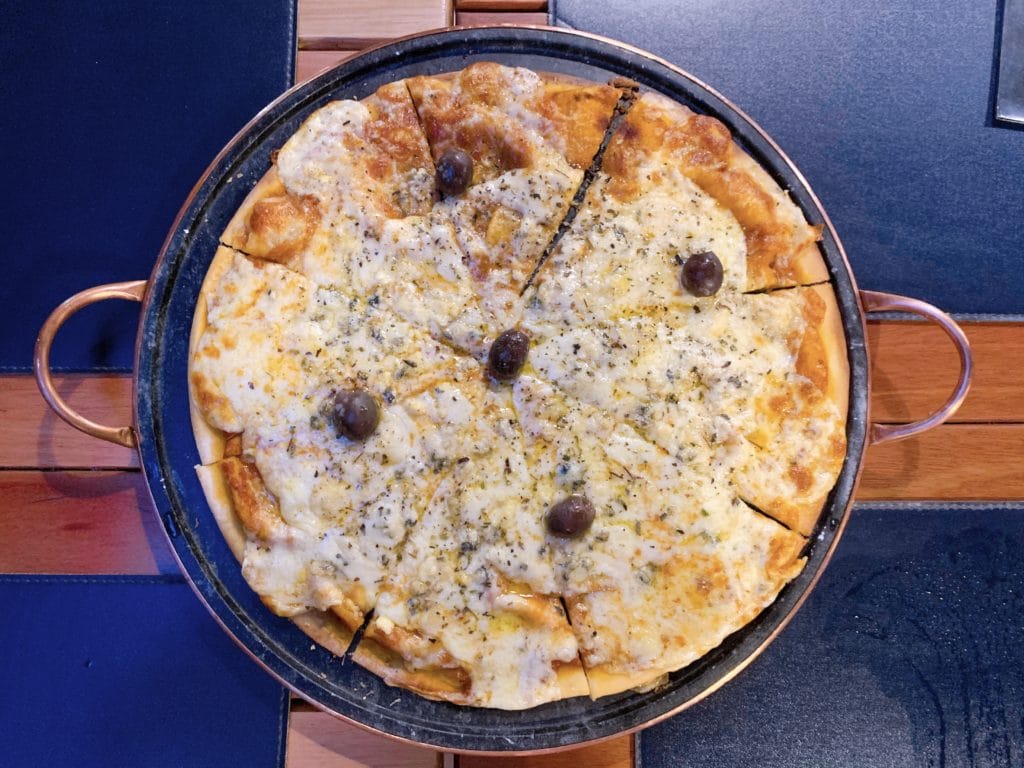 Four-cheese pizza at Avenida Grill Restaurante Bar